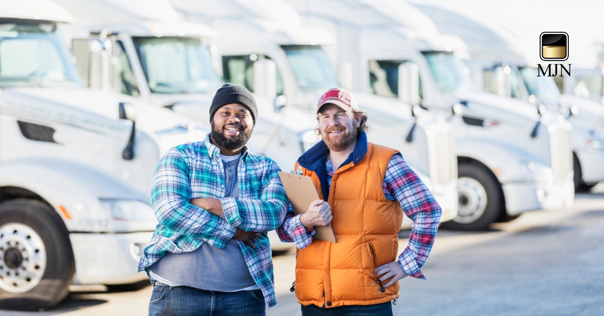 Truck driver standing next to a semi-truck with confidence.
