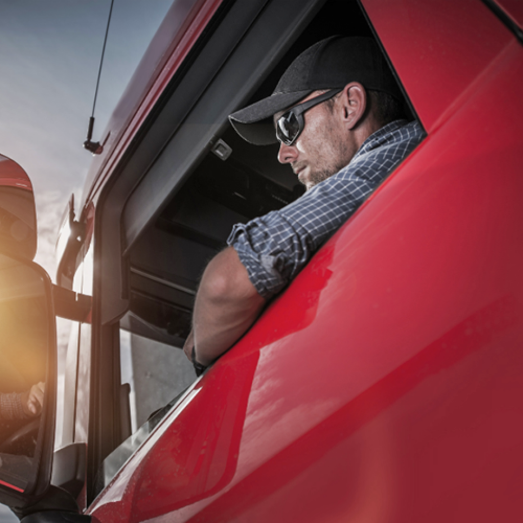 Business handshake between trucker and factoring partner