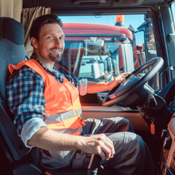 Happy truck driver after receiving fast payment through factoring